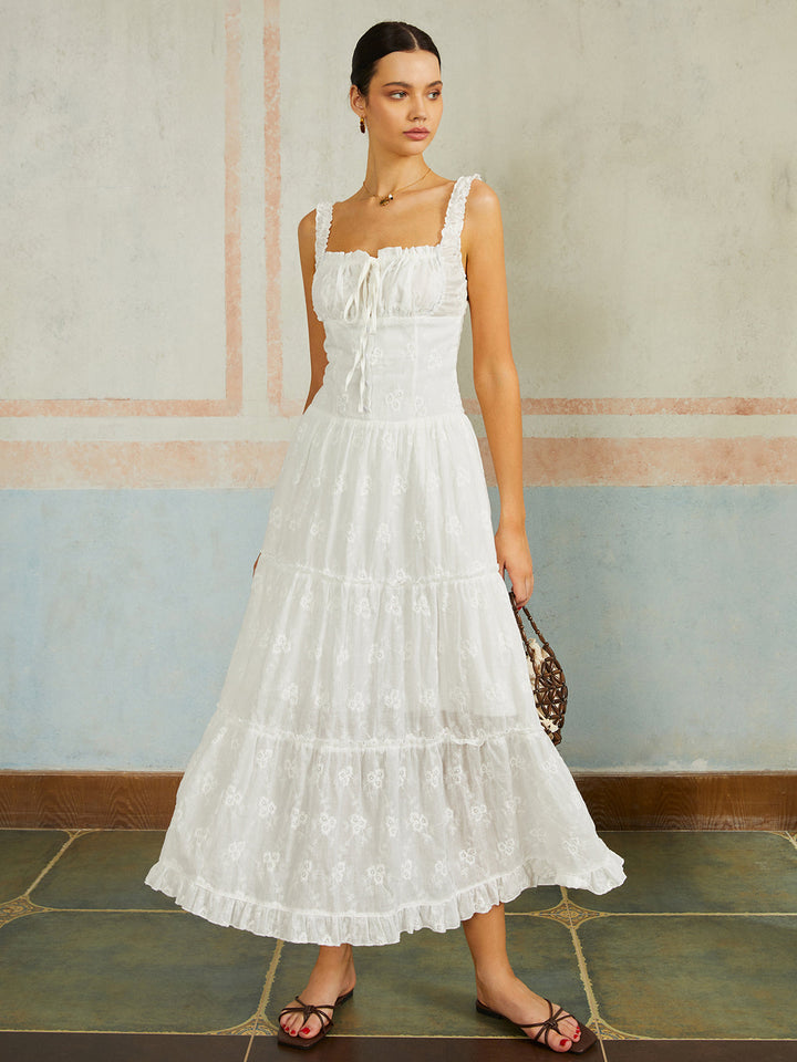 Дълга рокля без ръкави с бродерия и пола с волани