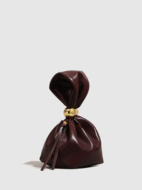 Обикновена чанта с овална форма и връзки 