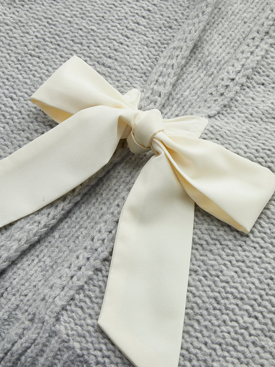 Плетена топ с двойно закопчаване и панделка 